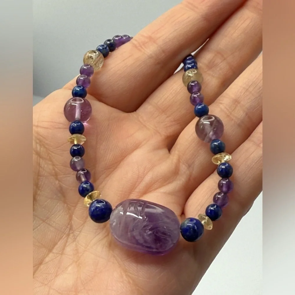 Carved amethyst lizard pendant with amethyst rock crystal necklace